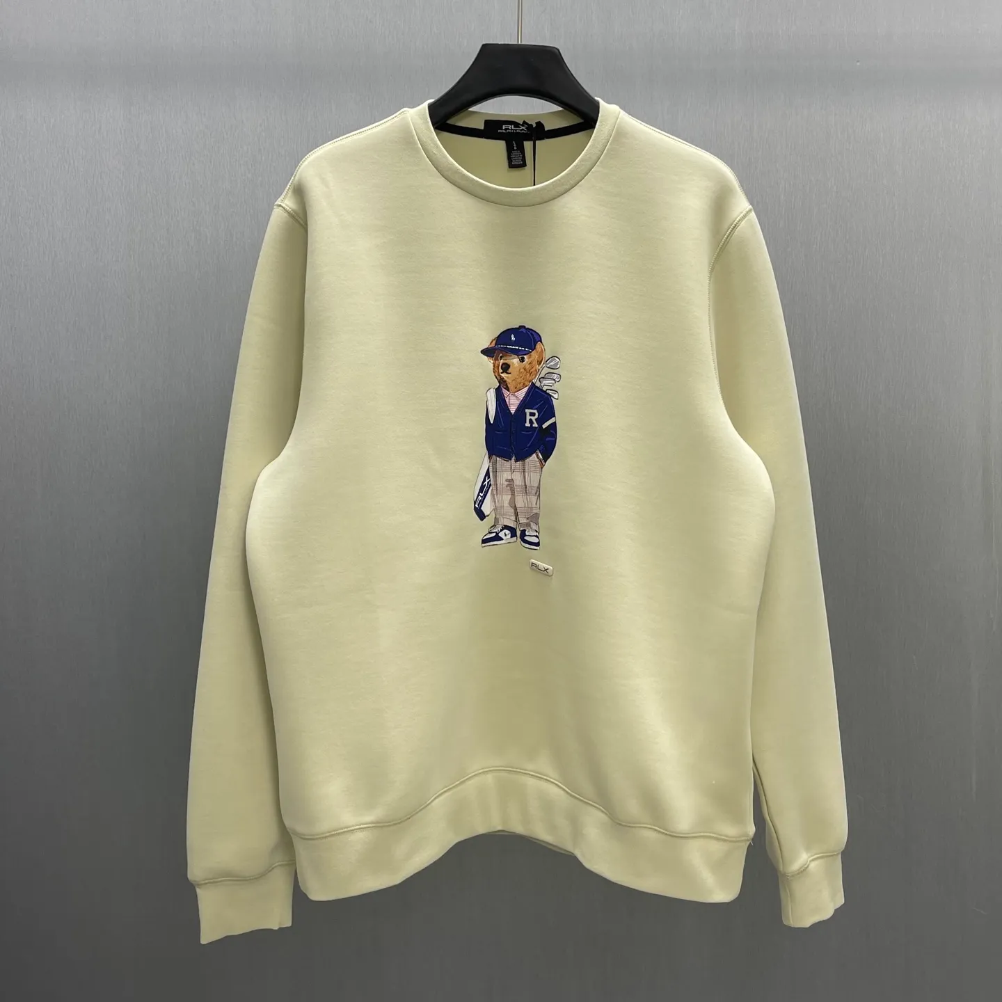 P350 🧧LRX Ralph Lauren Bear Sweatshirt Size: S-XL Carefully made in Italy, this sweatshirt is decorated with an elegant Polo Bear patch that reflects Purple Label's relentless pursuit of craftsmanship. Our beloved mascot is wearing this season's Purple Label collection suit on the patch. The bear's entire outfit is made from actual fabrics from the collection, including the pinstripe Kent jacket, Gregory The trousers and matching spectator shoes feature refined details such as a sewn-in drawstring at the ends and a jersey-lined hood.